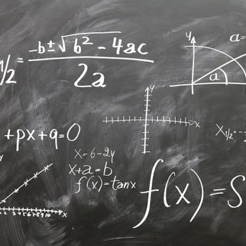 blackboard with complex mathematical equations