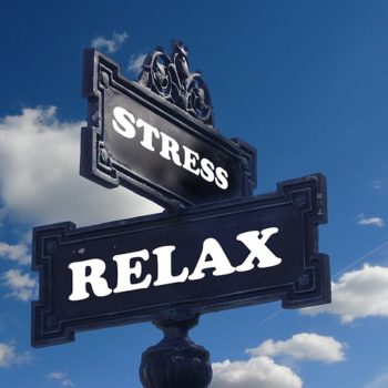 Street signs showing intersection of "stress" and "relax"