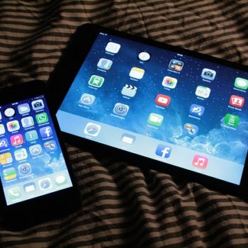 Tablet and phone on the bed