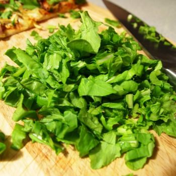 Chopped arugula on a cutting board