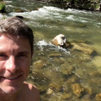 Tim near a creek in the mountains